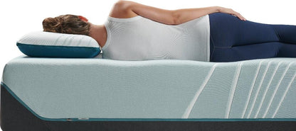 Side view of a woman using the Tempur-Pedic TEMPUR-Adapt® ProLo Pillow, emphasizing ergonomic support for a restful sleep. Available at Sleepology Mattress Shop.