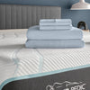 TEMPUR-Breeze® Cooling Sheet Set folded and displayed on a Tempur-Pedic mattress, showcasing its cooling technology and quality fabric - Available at Sleepology Mattress Shop.