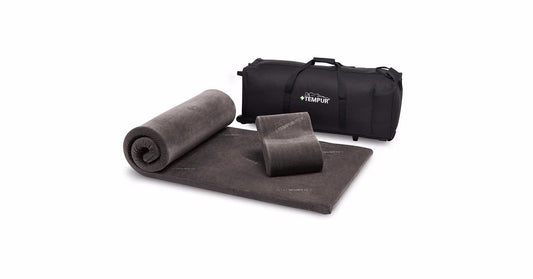 The Tempur-Pedic Travel Set displayed with its components, including a rollable mattress topper, supportive memory foam neck pillow, and a black carrying case, offering unmatched comfort and portability for travelers.